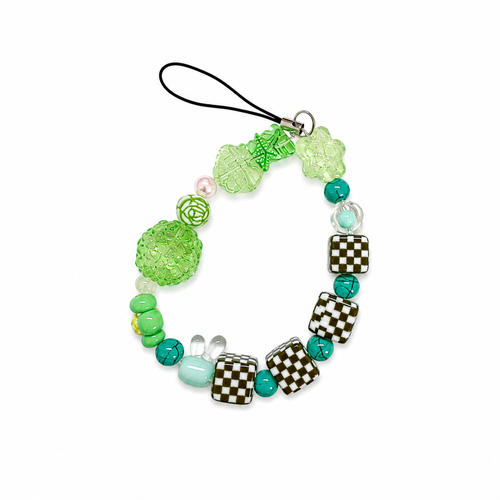 Check Mate bag charm with checkerboard beads, green sparkly ball, rose, star, bunny, and teal beads