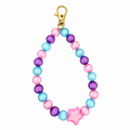 Bubble Star Bag Charm with translucent pink, blue, and purple beads and a pink star charm on a gold lobster clasp