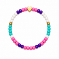 Skip a Beat Bracelet - pink, purple, teal and white beads with a gold heart centrepiece