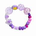 Plum Tum Bracelet featuring chunky purple flower charms, clear faceted beads and pops of hot pink and lavender