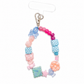 Sweet Sidekick Phone Charm with pastel gummy bear, bunny, flower, star and checkered cube beads on a silver lobster clasp