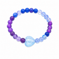 Heart of the Sea beaded bracelet with blue and purple beads and a light blue heart centrepiece